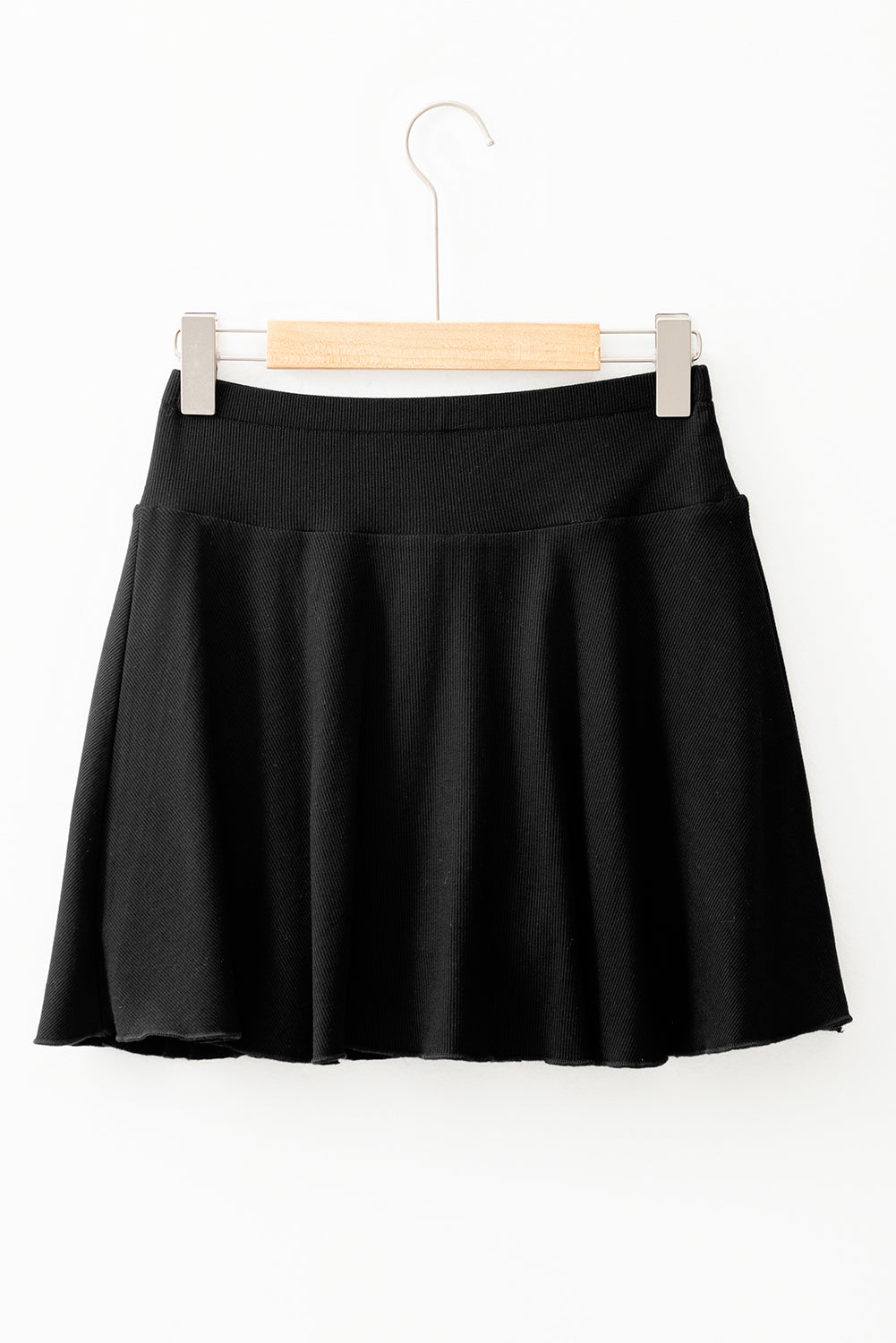 Jupe-short noire trapèze drapée taille haute et poches doublées