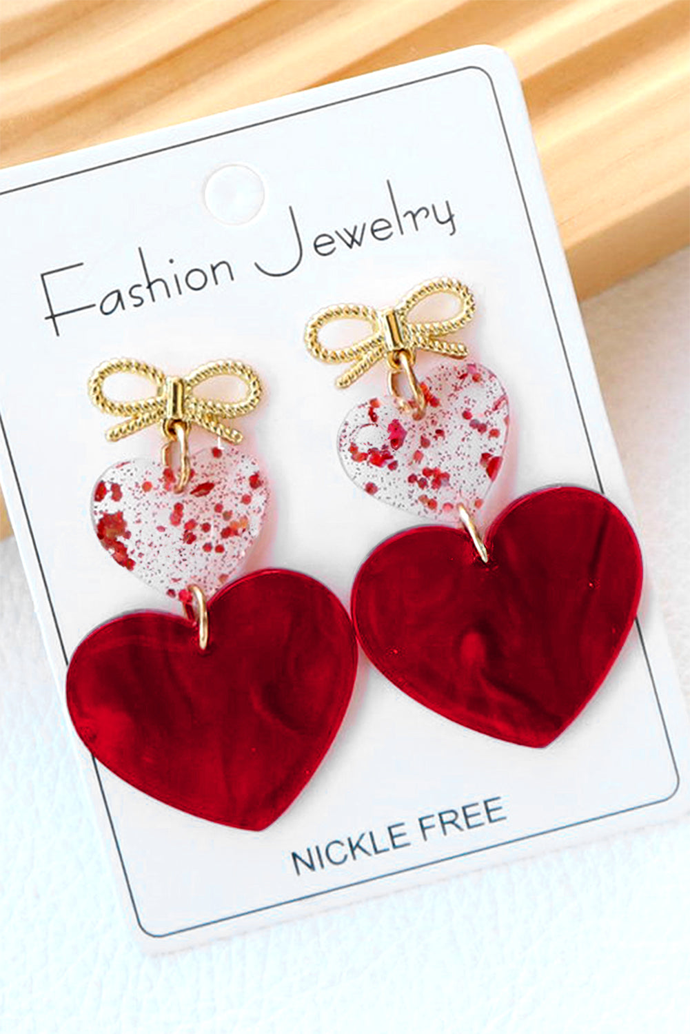 Boucles d'oreilles de Saint-Valentin en forme de nœud papillon et de cœur rouge ardent