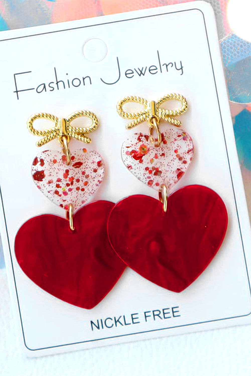 Boucles d'oreilles de Saint-Valentin en forme de nœud papillon et de cœur rouge ardent