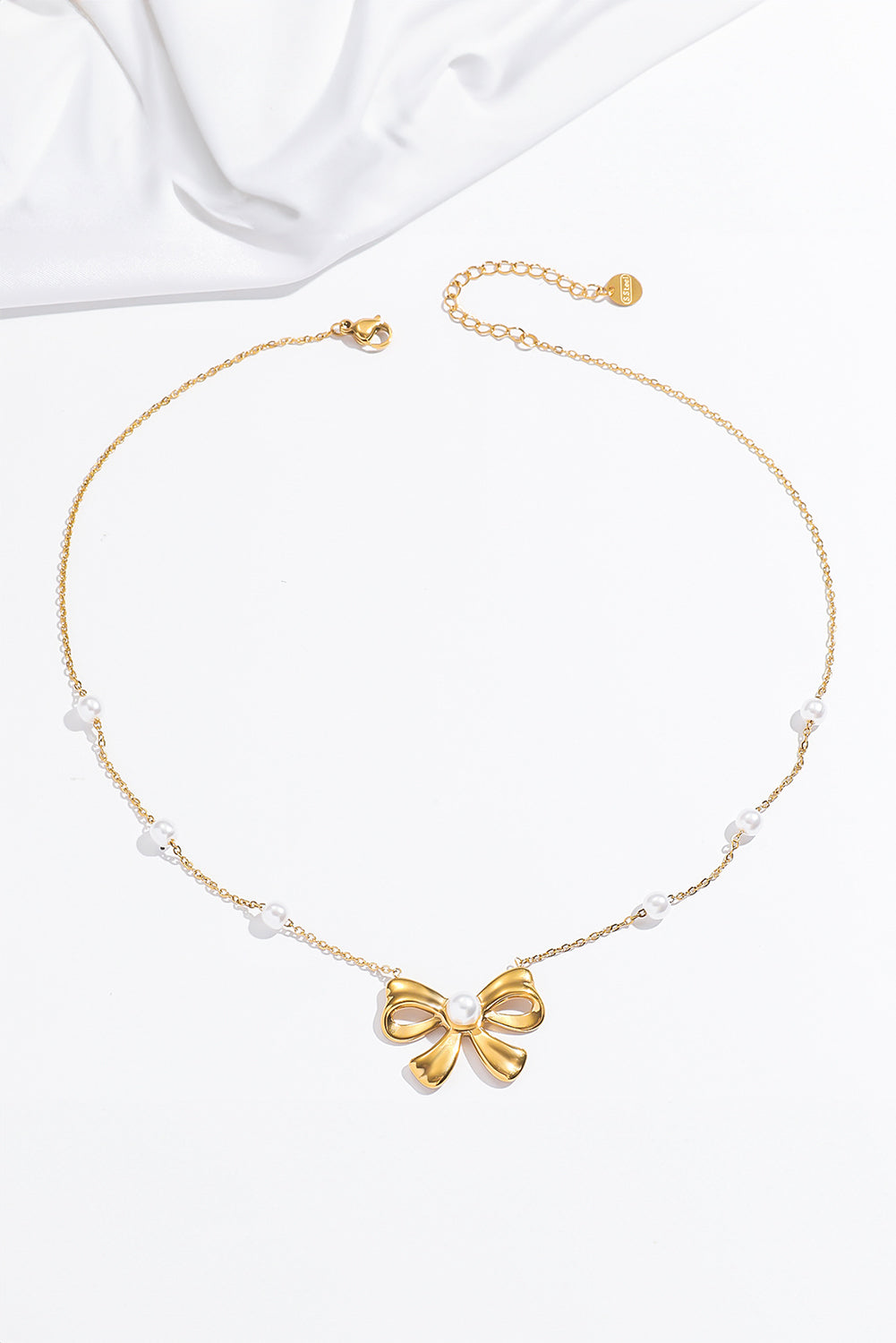 Collier élégant en perles d’or Bowknot